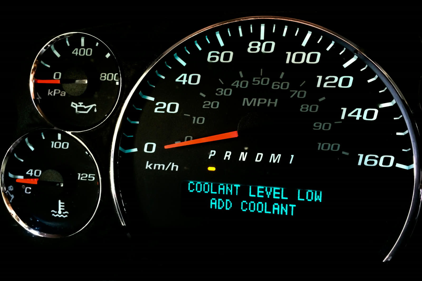 Coolant leaking from a radiator hose under a vehicle