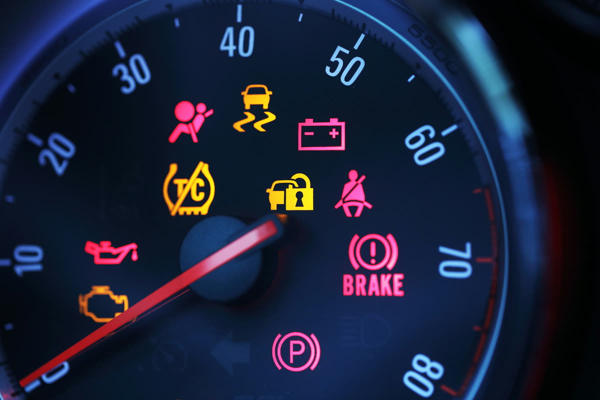 Brake system and ABS warning lights illuminated on a dashboard