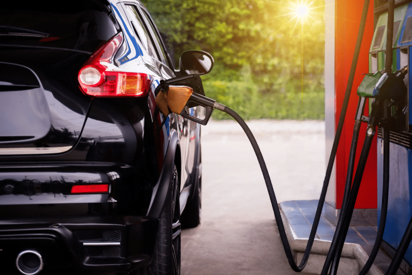 Blue Ridge Automotive | How Driving in a Stop-and-Go Traffic Affects Your Car Black SUV refueling at a gas station after frequent stop and go traffic driving.