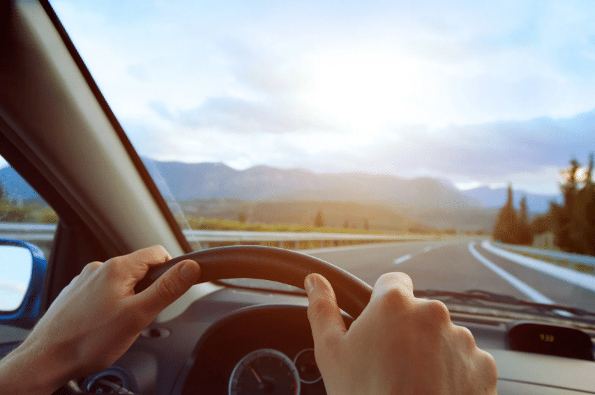 Blue Ridge Automotive | How Driving in a Stop-and-Go Traffic Affects Your Car Person driving on an open road after dealing with heavy stop and go traffic.