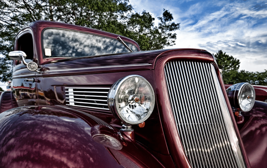Vintage car representing the early days in the history of auto mechanics and vehicle design.