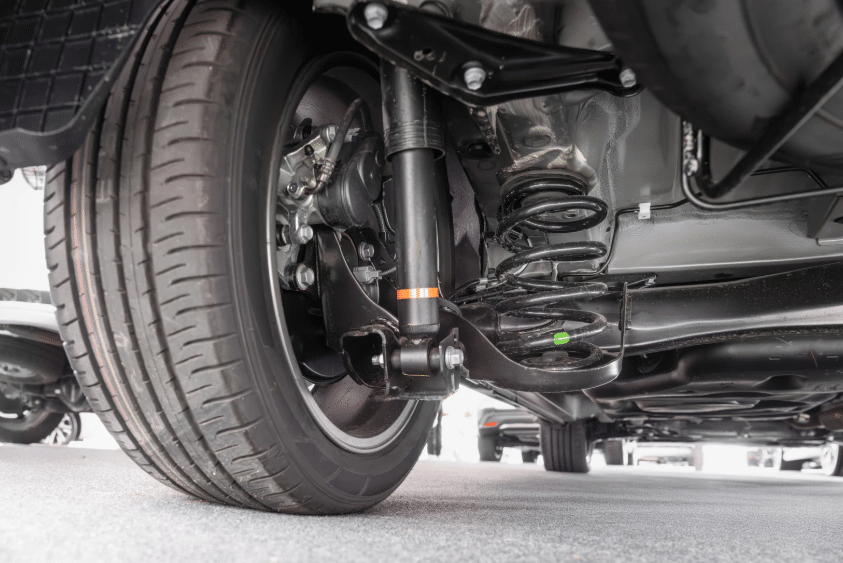 Blue Ridge Automotive | Why a Suspension Check Matters: Protect Tire Life and Vehicle Safety Detailed view of a vehicle's suspension system and tire during a suspension check.