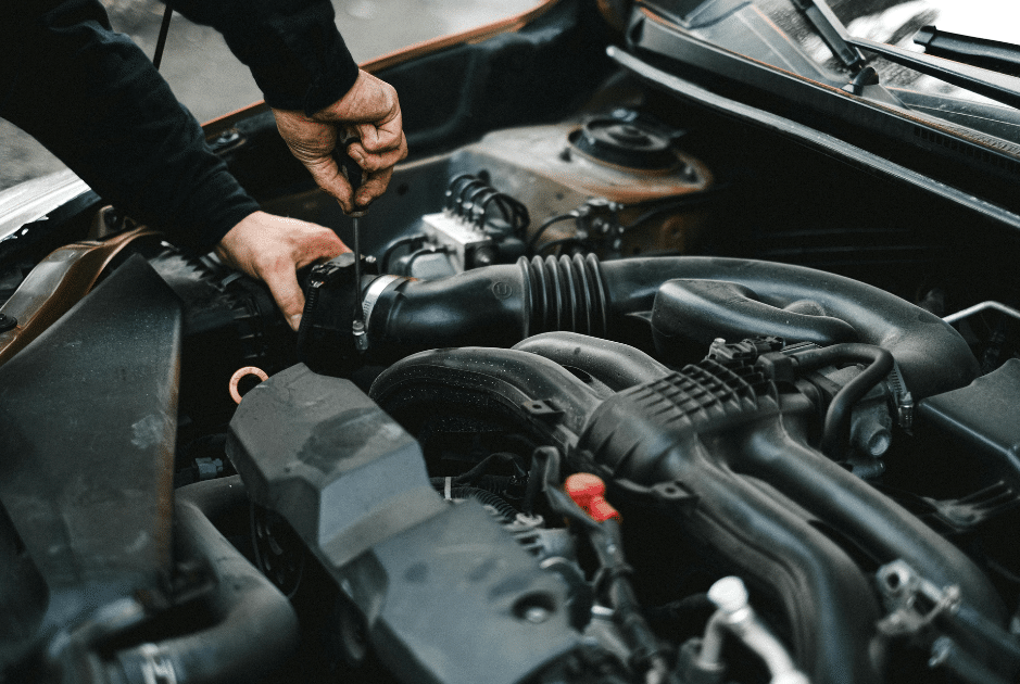 mechanic inspecting radiator Blue Ridge Automotive Marietta